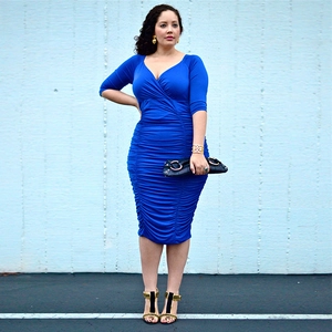 Detail of the royal blue ruched V-neck dress featuring slim fit waist design and midi length