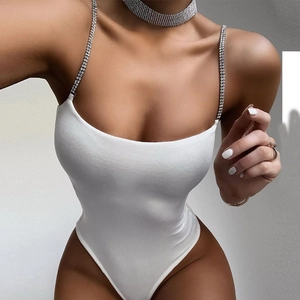 Close-up of white bodysuit with luxury rhinestone straps and matching choker necklace