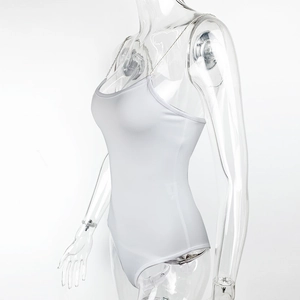 Detail shot of slim-fit white bodysuit featuring elegant metallic chain straps