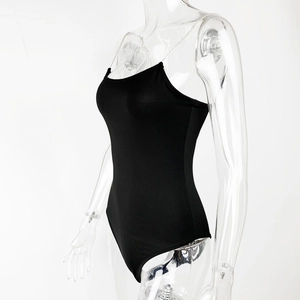 Detail of black bodysuit featuring elegant diamond metal chain straps and slim fit design