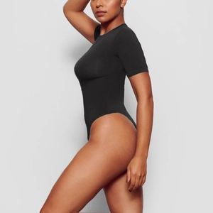 Slim fit black short sleeve bodysuit for women with a round neck and shaping fabric