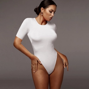 Close-up of white short sleeve bodysuit featuring high-cut leg and crew neck