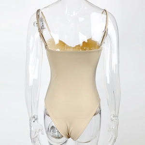 Rear view of nude backless bodysuit featuring thin straps and high-stretch fabric