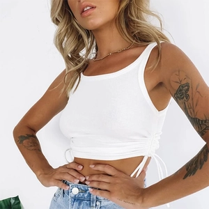 Detailed close-up of white ribbed crop top featuring adjustable side drawstring and ruching