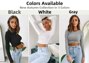 Detail of ribbed long sleeve crop top featuring side drawstring ruching in black, white, and grey