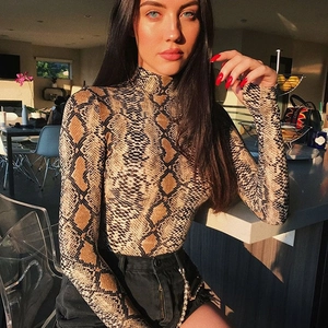 Close-up of snake skin pattern bodysuit with a high neckline and long sleeves