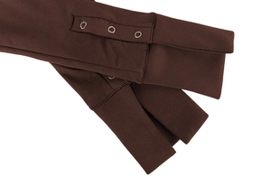 Detail of dark brown knit bodysuit sleeve with three silver metal snap buttons