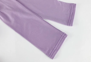 Detail of purple knitted dress sleeve with high-quality double-needle stitching
