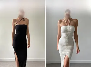 Detail view of ruched bodycon dresses in black and white with side slits and halter neck