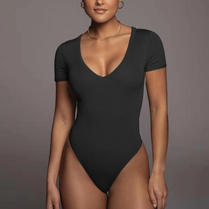 Close-up of black short sleeve bodysuit featuring deep V-neckline and slim fit silhouette