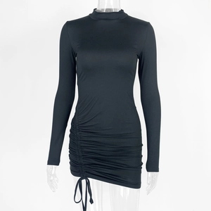 Detail of mock neck black slim fit dress featuring adjustable side drawstring ruching