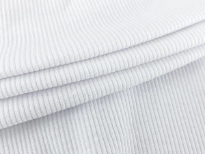 Close-up of white ribbed knit fabric showing detailed vertical texture and soft fiber quality