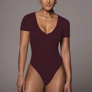 Detail of burgundy V-neck short sleeve bodysuit featuring high-stretch slim fit fabric