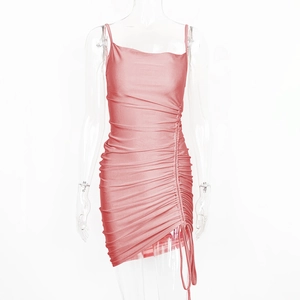 Detailed view of pink satin bodycon dress with side drawstring ruching and asymmetric hemline