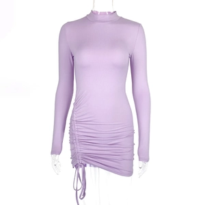 Detail view of the side drawstring ruching on a lavender slim fit bodycon dress