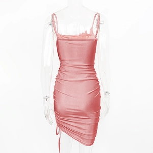 Detailed view of pink drawstring bodycon dress with shiny metallic finish and ruched texture