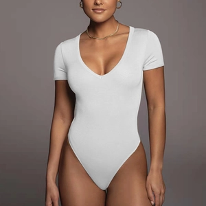 Detail of white V-neck short sleeve bodysuit with fine textured stretch fabric on model