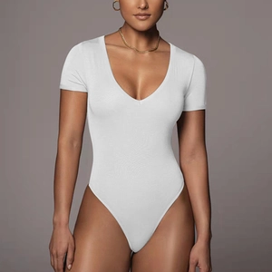 Detail of white short sleeve bodysuit with a deep V-neckline and form-fitting knit fabric