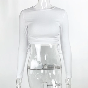 Detail of white ribbed crop top with side drawstring ties and ruched texture