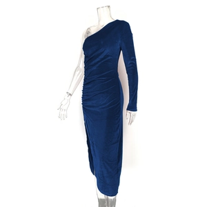 Detail of dark blue velvet dress featuring one-shoulder sleeve and side ruching detail