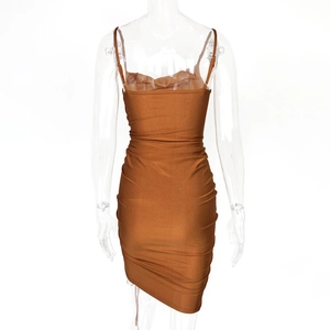 Detail view of caramel ruched bodycon mini dress with thin spaghetti straps and pleated fabric