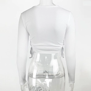 Detail view of white ribbed knit fabric with adjustable side drawstring ruched texture