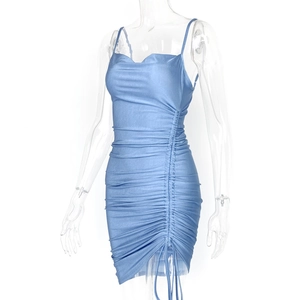 Detail of light blue glossy fabric and side drawstring ruching on bodycon dress