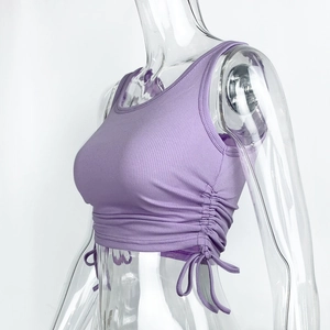 Detail of adjustable side drawstring and ribbed texture on lavender crop top
