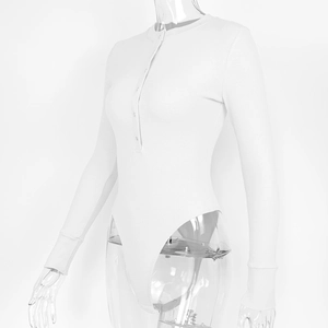 Detail of white ribbed bodysuit featuring a button-up neckline and long sleeves