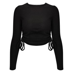 Slim fit black ribbed long sleeve crop top with side drawstring details on white background