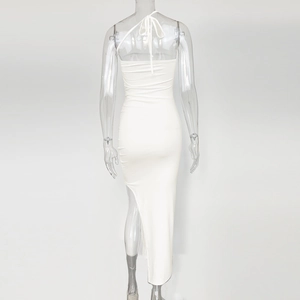Detail of white backless bodycon dress with drawstring halter neck and side high slit