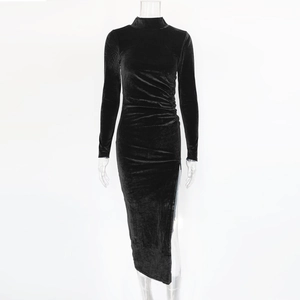 Detail of high neck velvet dress showing elegant ruching and side slit design
