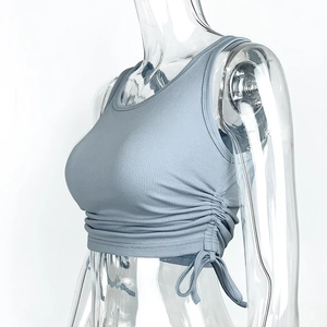 Detail view of light blue ribbed crop top featuring adjustable side drawstring ruching