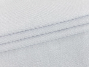 Detailed macro view of soft light grey knitted fabric with fine ribbed texture for women