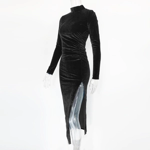 Detail of high collar black velvet dress featuring waist pleats and side split design