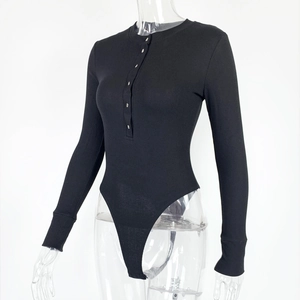 Close-up of black ribbed bodysuit featuring a henley neckline with silver metal buttons