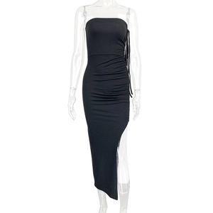 Detail of side drawstring ruching and slit on black bodycon strapless midi dress