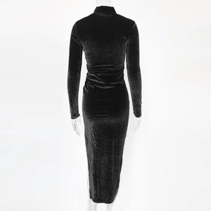 Detail view of black velvet dress featuring high neck and sleek long sleeve back silhouette