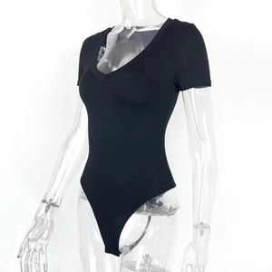 Detail of black V-neck short sleeve bodysuit with snap button closure on white background