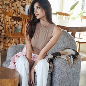 Slim fit mock neck sleeveless crop top in light brown styled with pink checkered shirt