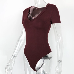 Detail view of burgundy short sleeve bodysuit with deep V-neck on transparent model