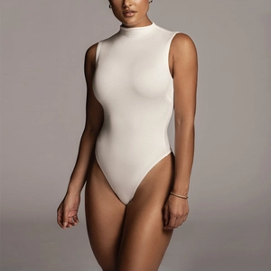 Close-up of white mock neck sleeveless bodysuit with premium ribbed fabric texture