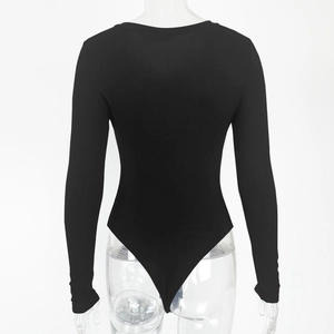 Back view of a sleek black long sleeve bodysuit on mannequin with high cut leg design