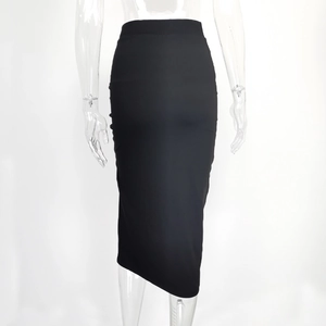 Detail view of high-waist black bodycon midi skirt with elastic knitting texture