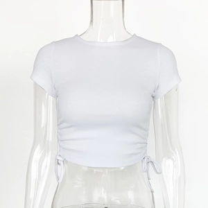 Close-up of white ribbed crop top featuring side drawstring details and crew neckline