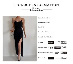 Detail of slit dress featuring metallic chain straps and side split on black fabric