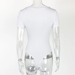 Detail of white short sleeve bodysuit featuring high cut bottom and snap closure design