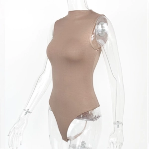 Detail of apricot sleeveless mock-neck bodysuit showing high-stretch knit fabric texture