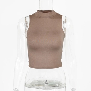 Detailed close-up of ribbed texture and high collar on dark brown sleeveless crop top