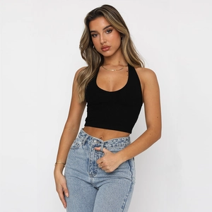 Women's black halter neck cropped top paired with light blue high-waisted jeans